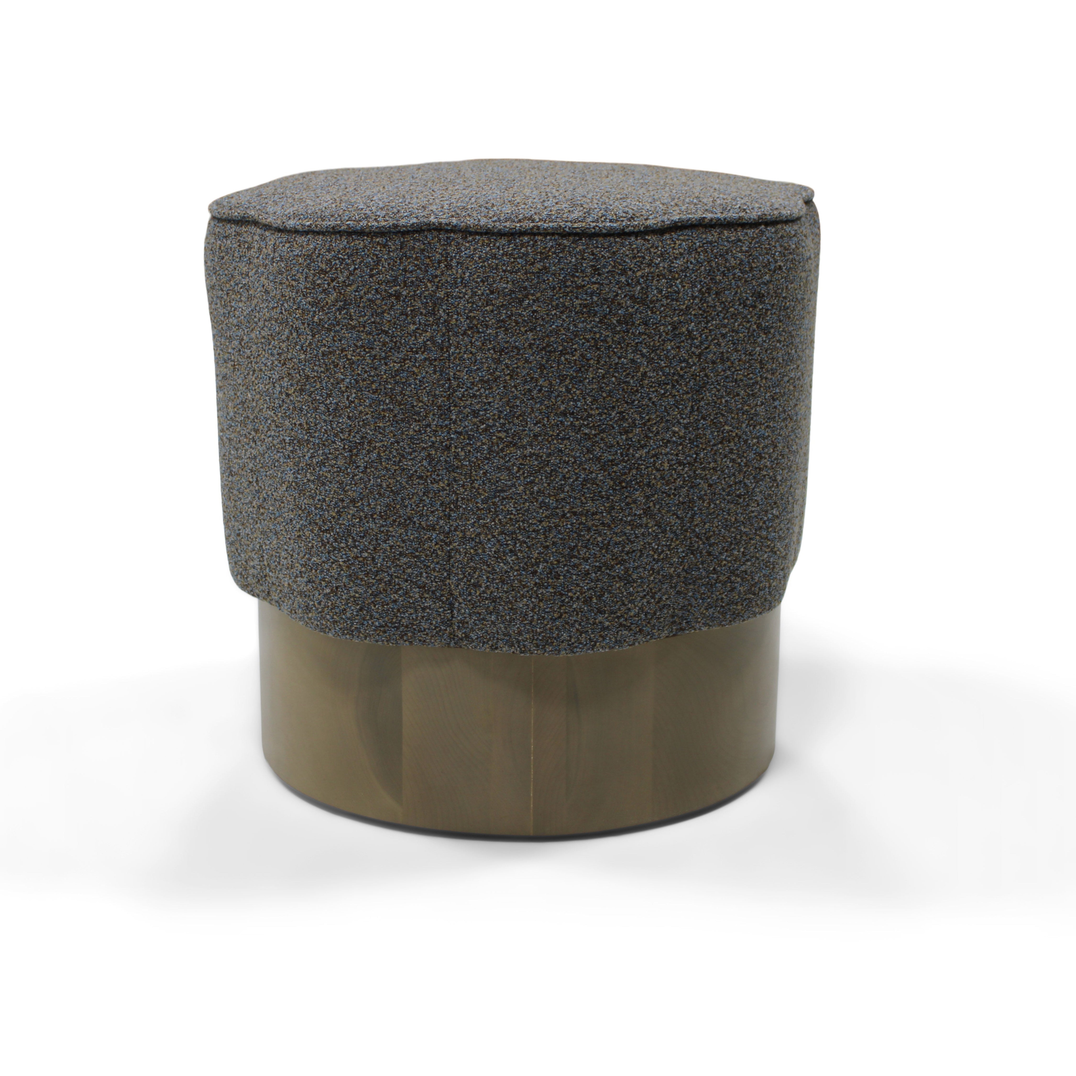 Gray cushioned stool on a white background